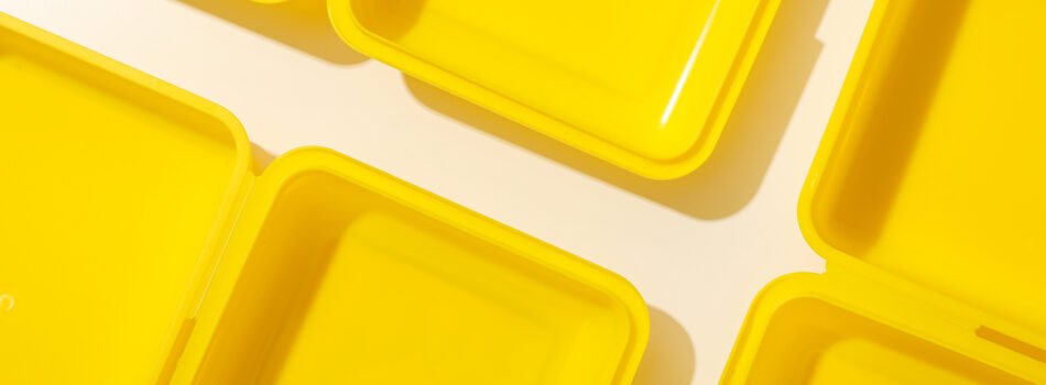 Yellow lunch box on a yellow background